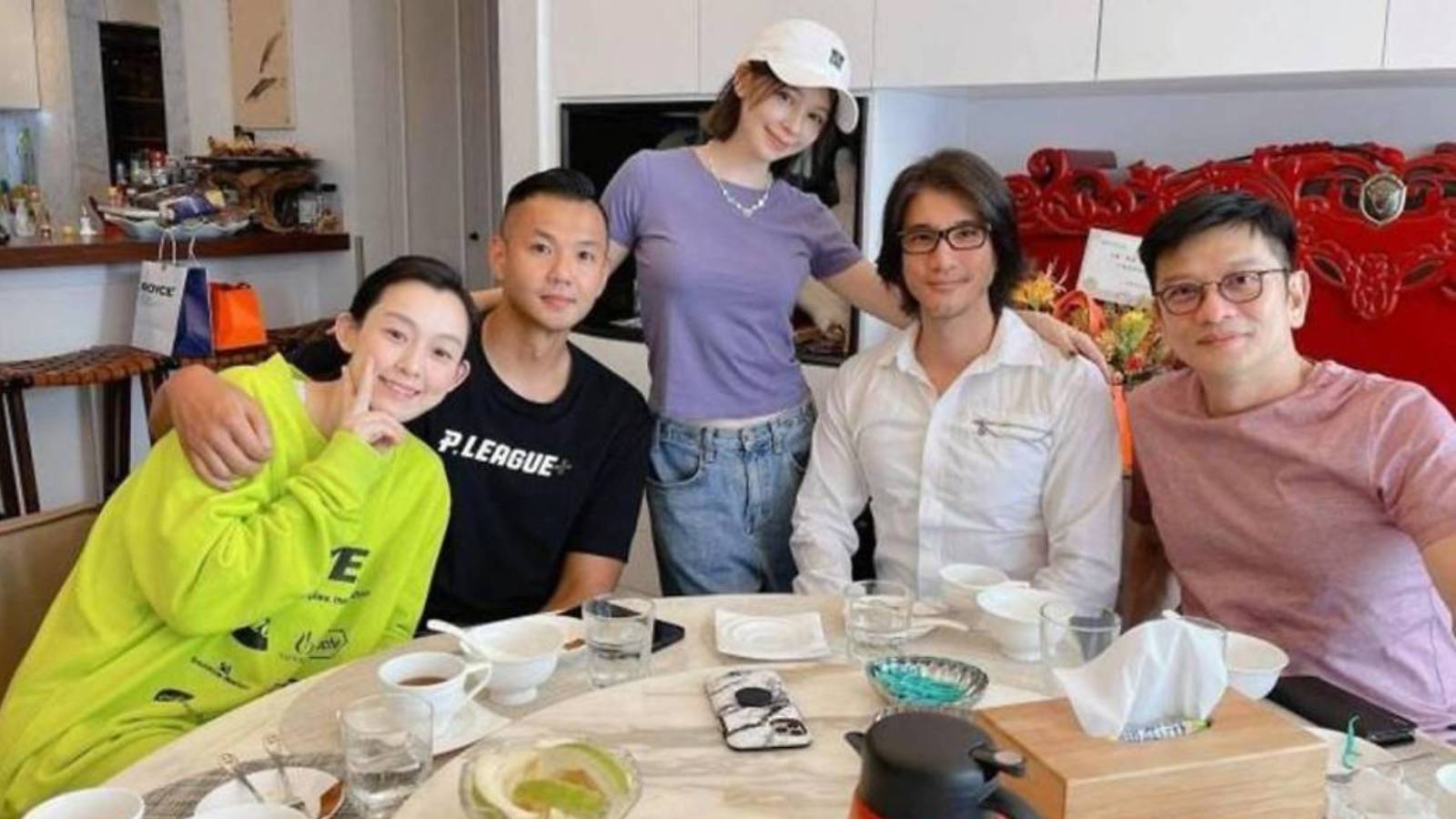 Leehom (in white) with Vivian (in purple) and friends during their gathering in Vivian's apartment