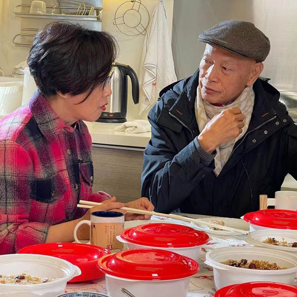 Liz and her husband Law Kar Ying doing a taste test