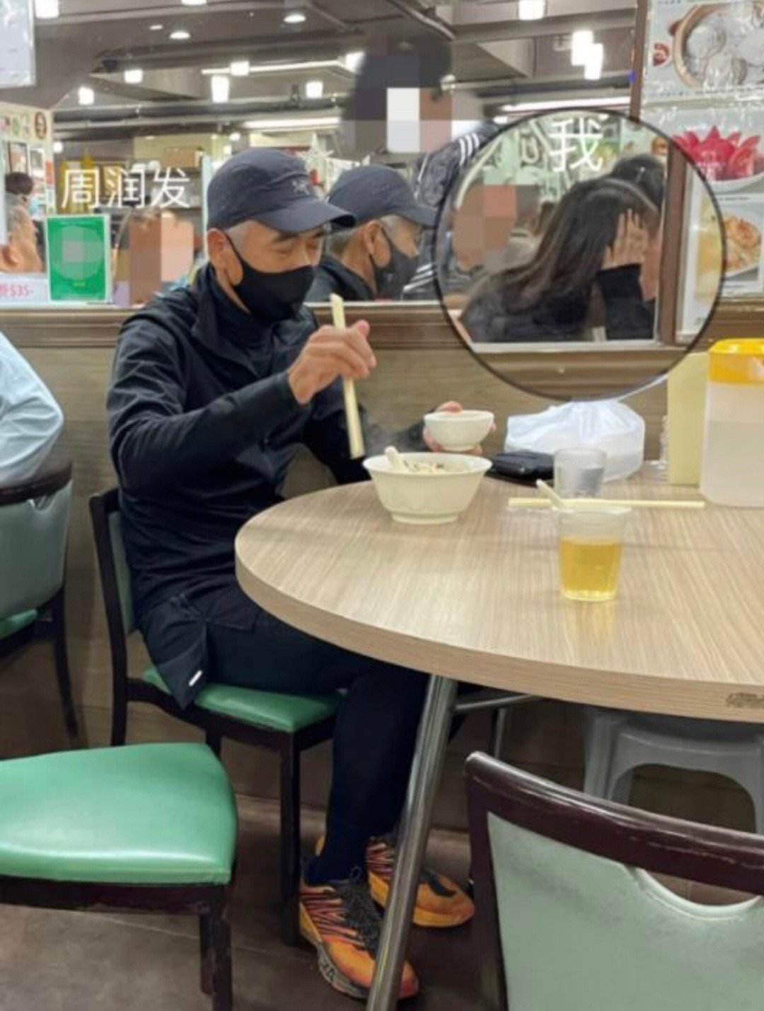 Fat Gor at another humble eatery, wearing what looks to be his default outfit