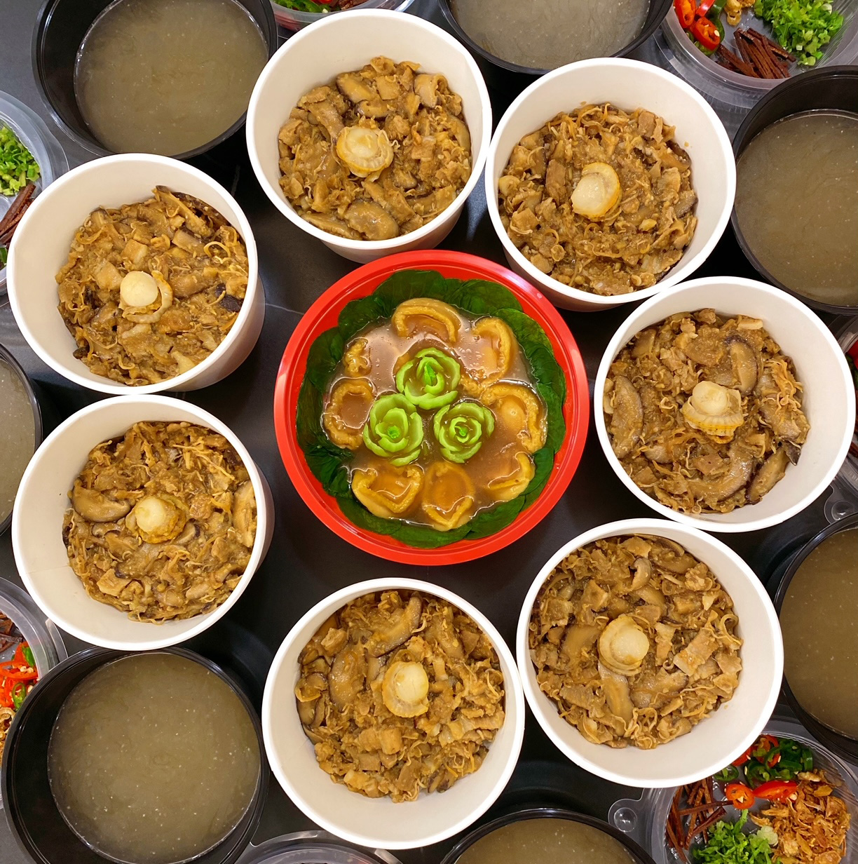 TrulyTeochew also offers sides like braised abalone with bok choy (centre)