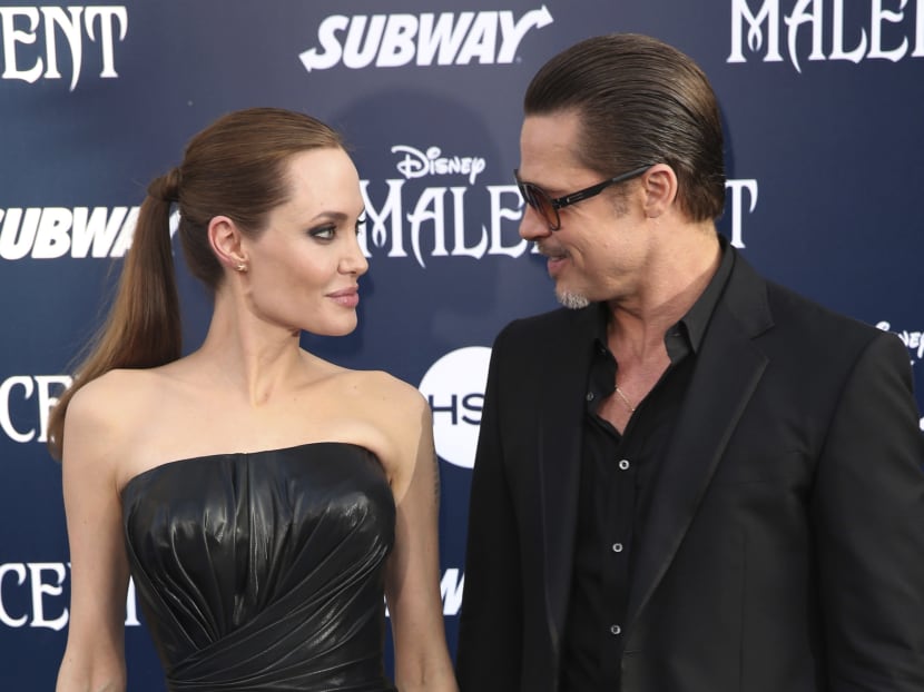 In this May 28, 2014 file photo, Angelina Jolie and Brad Pitt arrive at the world premiere of Maleficent in Los Angeles. Photo: Invision via AP