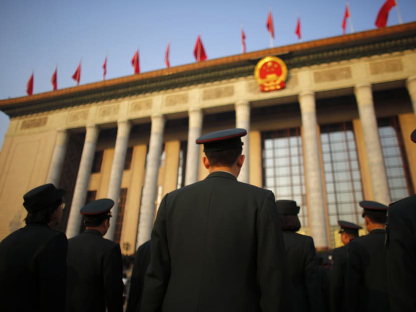 Military delegates arrive for the opening of the annual full session of the National People's Congress, the country's parliament, at Tiananmen Square in Beijing March 5, 2015. Photo: Reuters