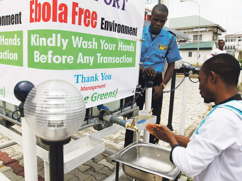 A man washing his hands at a tap in Abuja. Nigeria’s organised efforts to contain Ebola have shown the importance of logistics and public information awareness on top of medical care. Photo: REUTERS