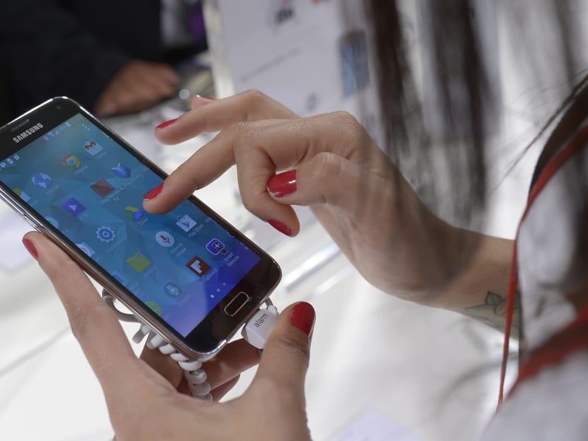 The Samsung Galaxy S5, which comes with the ability to make online purchases with just a fingerprint. Photo: AP
