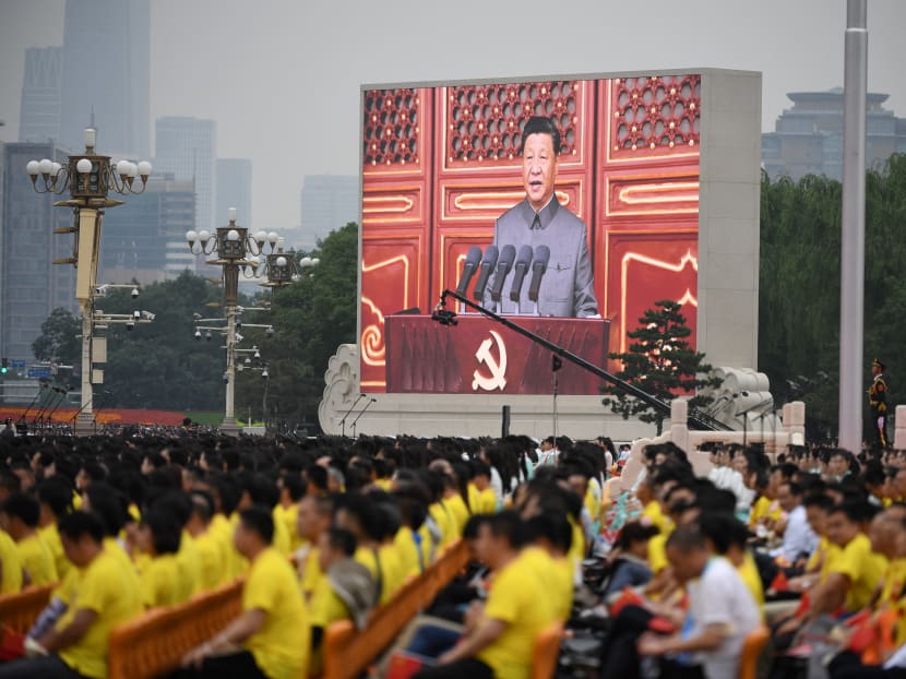 Chinese President Xi Jinping (on screen) delivers a speech during the celebrations of the 100th anniversary of the founding of the Communist Party of China at Tiananmen Square in Beijing, China on July 1, 2021.