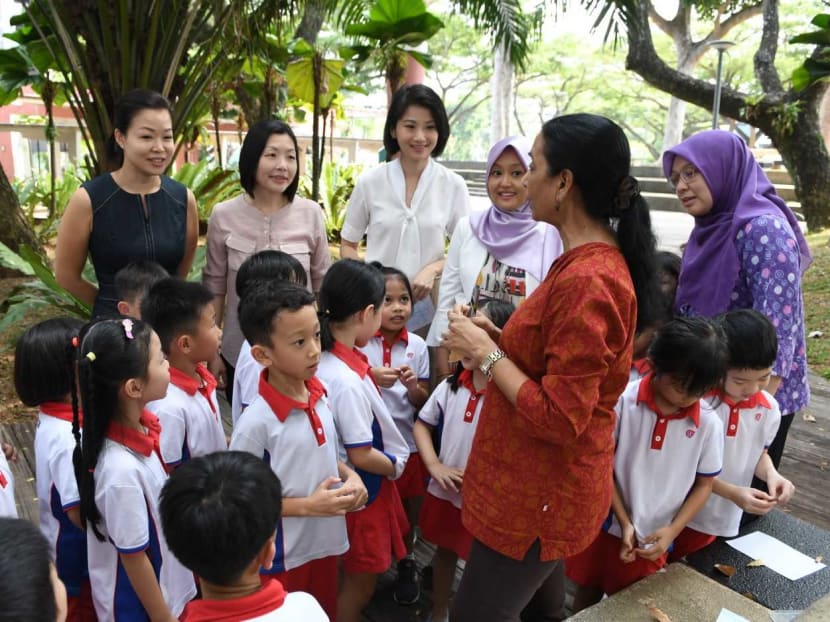 Members of the People's Action Party Women's Wing, led by Ms Sun Xueling (back row, third from left), Senior Parliamentary Secretary for Home Affairs and National Development, watch a PCF Sparkletots pre-school class on July 30, 2019.