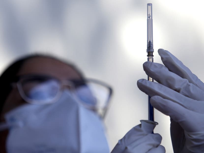 A nurse prepares a dose of AstraZeneca's Covid-19 vaccine at the vaccination centre set up at the Autonomous University of Guadalajara in Zapopan, Jalisco state, Mexico on April 6, 2021.