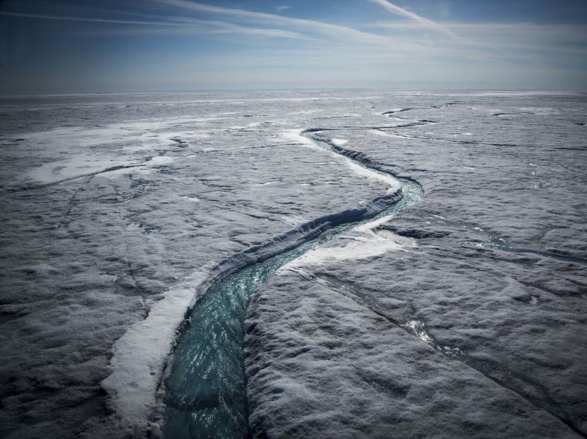 Meltwater flows along a supraglacial river on the Greenland ice sheet. In theory, melting Arctic ice will create a significant economic opportunity, but it is hard to predict exactly how and where polar ice will melt, says the author. Photo: The New York Times