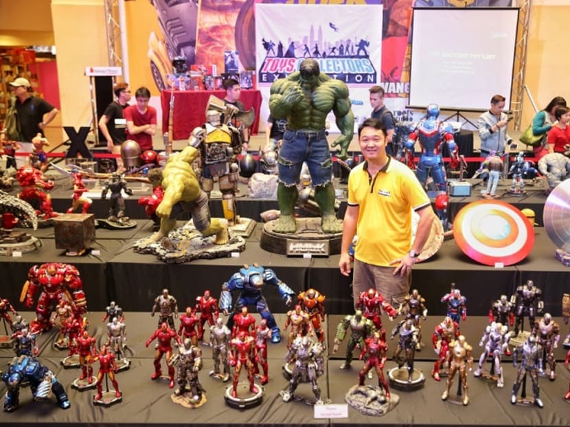 Tang Kok Weng poses with some of the toys from his personal collection at the Toy Collectors Exhibition. Photo: Saw Siow Feng/Malay Mail Online