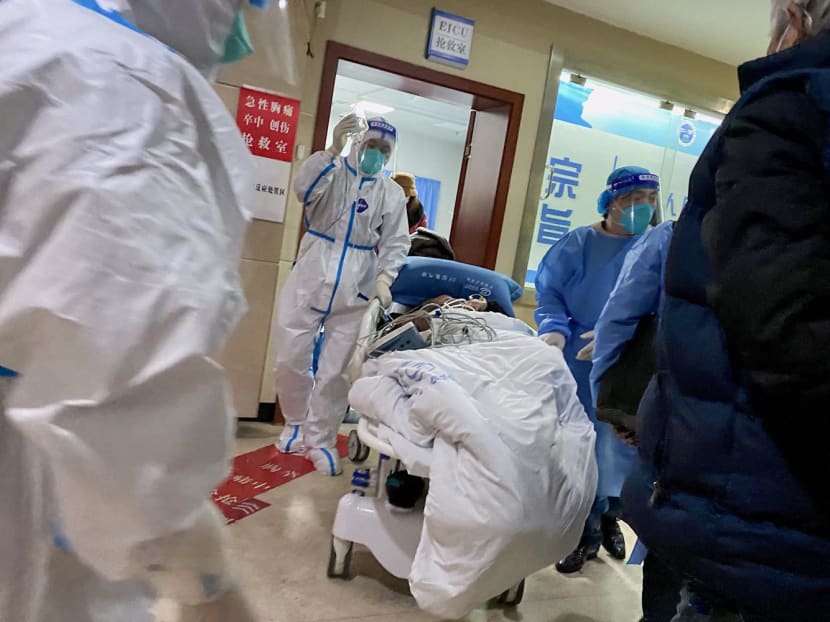 Health workers transport a Covid-19 coronavirus patient through the Chongqing No. 5 People's Hospital in China's southwestern city of Chongqing on Dec 23, 2022.