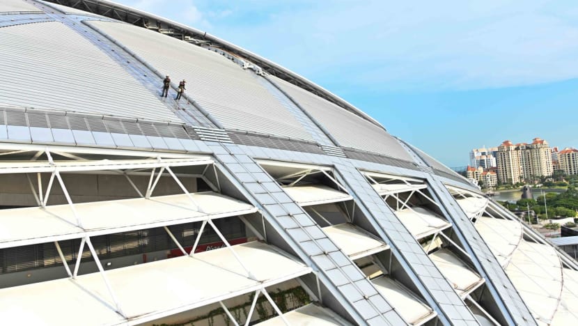 What does it take to clean the world’s largest dome? Men suspended by ropes