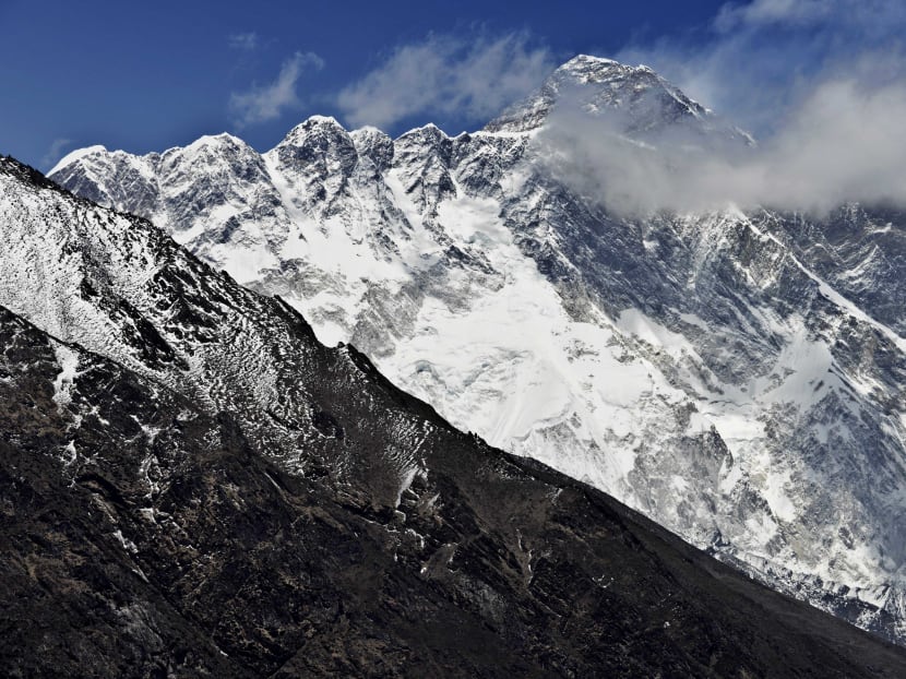In this photograph taken on April 20, 2015, Mount Everest (Background) and the Nupse-Lohtse massif (Foreground) are seen from the village of Tembuche in the Kumbh region of north-eastern Nepal. Photo: AFP