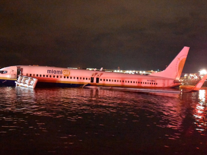 A charter plane slid off the runway at the naval air station in Jacksonville, Florida, and into the St. Johns River in the United States. A charter plane slid off the runway at the naval air station in Jacksonville, Florida, and into the St. Johns River in the United States.