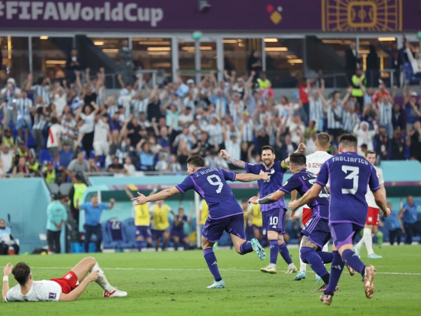 Argentina's forward Julian Alvarez (centre) celebrates scoring his team's second goal during the Qatar 2022 World Cup Group C football match between Poland and Argentina at Stadium 974 in Doha on Nov 30, 2022.