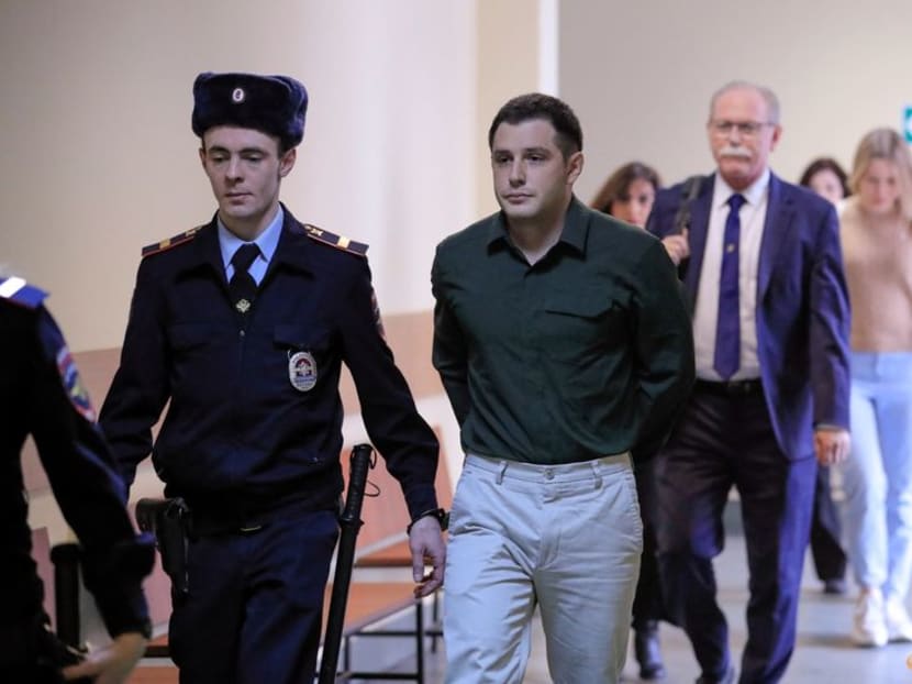 US ex-Marine Trevor Reed, who was detained in 2019 and accused of assaulting police officers, is escorted before a court hearing in Moscow, Russia March 11 2020. US ex-Marine Trevor Reed, who was detained in 2019 and accused of assaulting police officers, is escorted before a court hearing in Moscow, Russia March 11 2020.