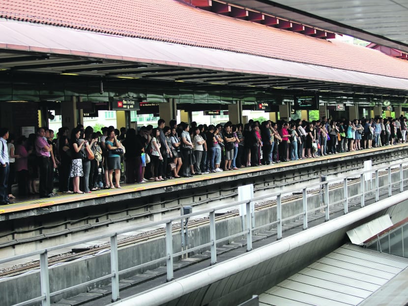 Choa Chu Kang MRT Station packed with commuters during peak hours. TODAY file photo