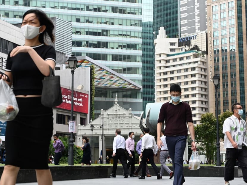 People walking during their lunch break at the financial business district of Raffles Place in Singapore on Jan 11, 2021.