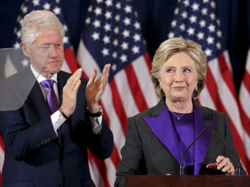 Mrs Hillary Clinton (right, with her husband Bill) said that she felt pride in the campaign that she ran. Photo: Reuters