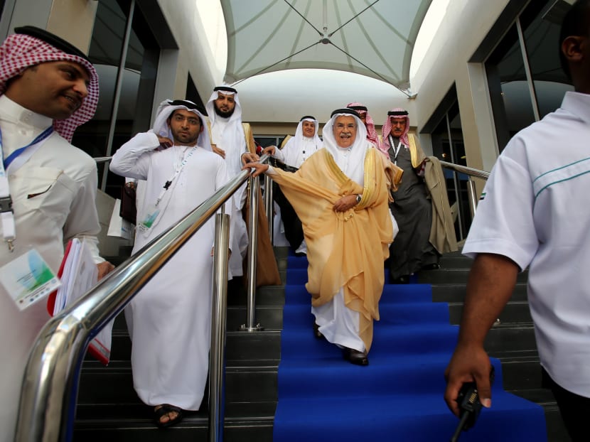 Saudi Arabia's Minister of Petroleum and Mineral Resources Ali Ibrahim Naimi leaves the hall during the opening day of the 10th Arab energy Conference in Abu Dhabi, United Arab Emirates. Photo: AP