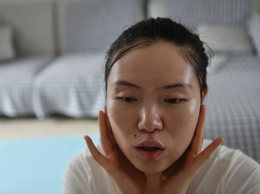 This photo taken on July 13, 2020 shows former massage therapist Xiao Jia during an online makeup class she teaches for blind people at her home in Beijing. When Ms Xiao Jia lost her sight as a teenager she was told the "respectable" career choice was to become a massage therapist. Instead she found an industry rife with abuse and aggression, where women are afforded little protection.