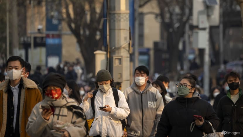 China says 200 million treated, pandemic 'decisively' beaten