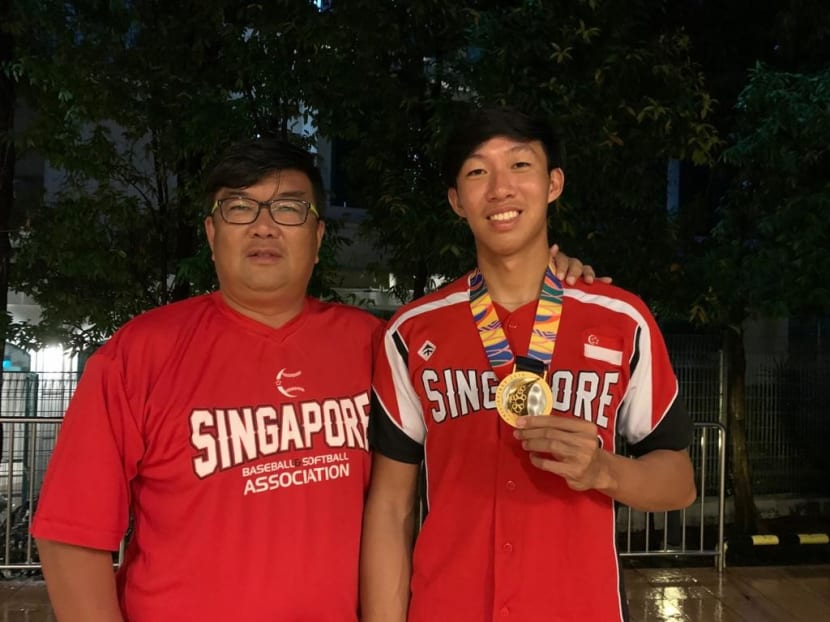 Aloysius Ong (right) took up his father's advice to push back his studies, and is now part of the Singapore softball team that scored a historic win at the 2019 Southeast Asian Games.