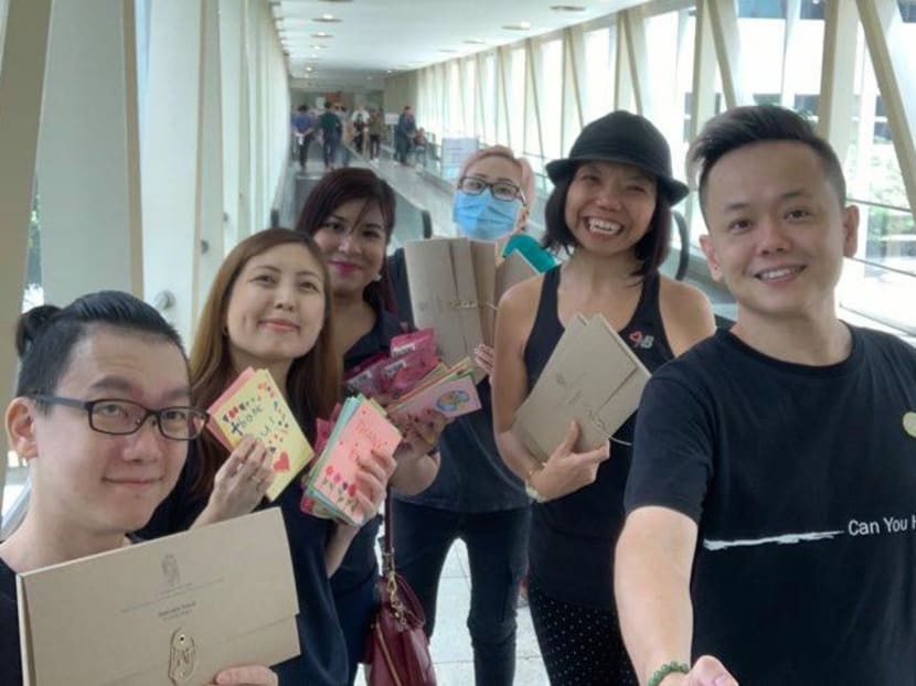 The author (second from right) and volunteers presenting thank-you cards written by primary school kids to staff at Tan Tock Seng Hospital on Feb 14, 2020. Mr Low Kok Hwa (extreme left), who is deaf, later led an effort to distribute self-care kits to healthcare workers.