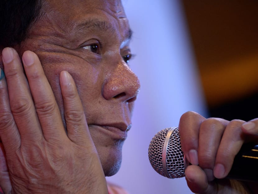 Mr Rodrigo Duterte gestures during a press conference after he cast his vote in Davao City, on the southern island of Mindanao on May 9, 2016. Photo: AFP