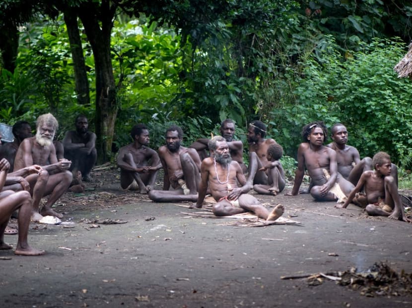 This picture taken on April 12, 2021 shows tribesmen holding a meeting in Yaohnanen, near the town of Yakel, a remote Pacific village on the island of Tanna in Vanuatu that worships Britain's Prince Philip, following the Duke of Edinburgh's death on April 9.
