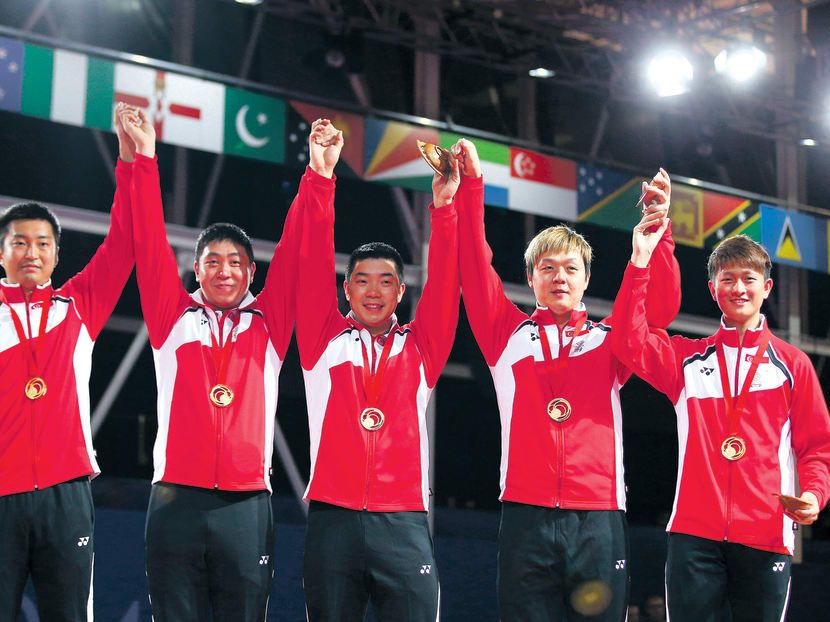 From left:  Yang Zi, Gao Ning, Zhan Jian, Li Hu and Clarence Chew celebrate winning gold after beating England 3-1 in the final. Photo: GETTY IMAGES