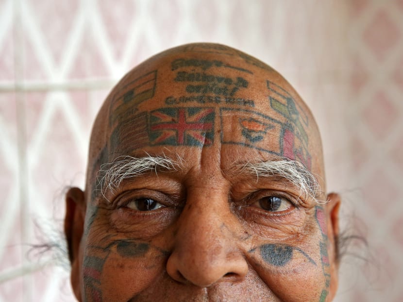 Gallery: For world records, Indian man removes teeth and gets over 500 tattoos