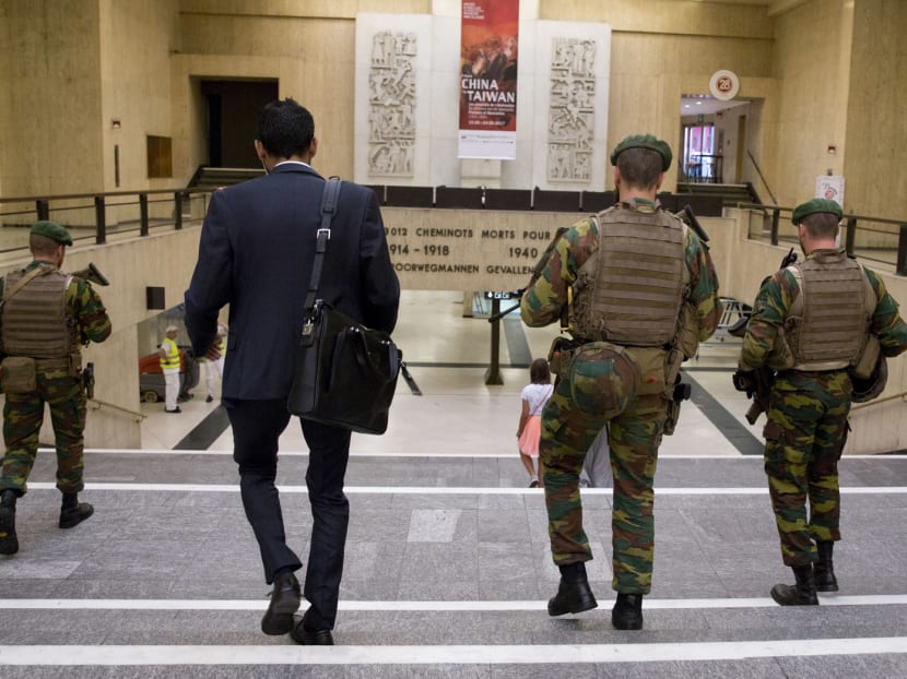 Belgian Army soldiers on patrol inside Central Station in Brussels yesterday. The Belgian capital has been on high alert since suicide bombers struck Zaventem Airport and the Maelbeek metro station near the EU quarter in March last year, killing 32 people and injuring hundreds more. Photo: AP