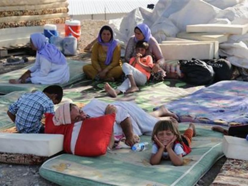 Displaced Iraqis from the Yazidi community settle at the Qandil mountains near the Turkish border outside Zakho, 475 km northwest of Baghdad, Iraq, Saturday, Aug. 16, 2014. Photo: AP