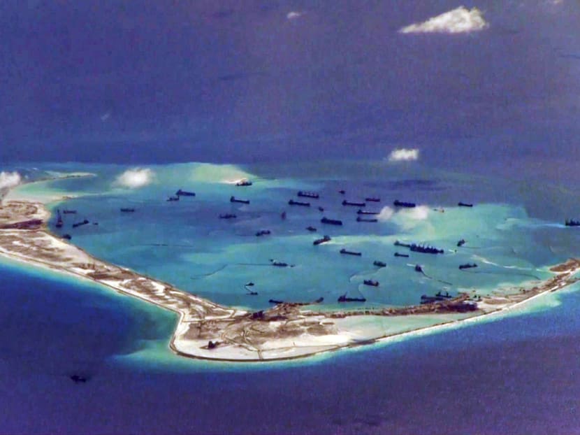 Land reclamation by China in May at Mischief Reef, close to where a US warship did a sail-by last month. The US has exercised its freedom of navigation largely by sailing just outside Chinese waters. Photo: Reuters