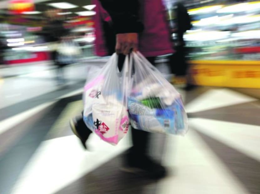 A person holding a plastic bag. Reuters file photo