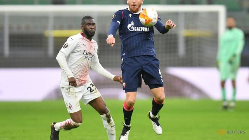 Football: Milan limp through on away goals after draw with Red Star Football: Milan limp through on away goals after draw with Red Star