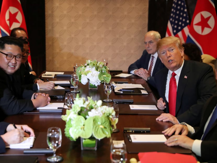 US President Donald Trump is seen with North Korea's leader Kim Jong-un before their expanded bilateral meeting at the Capella Hotel on Sentosa island in Singapore June 12, 2018.