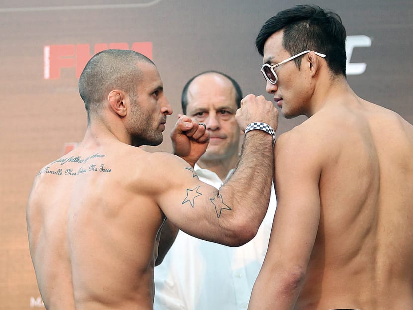 MMA fighters Tarec Saffiedine (left) and Lim Hyun Gyu at the UFC Fight Night Weigh-in. Looking on is former UFC Asia managing director Mark Fischer (centre). 
TODAY File Photo