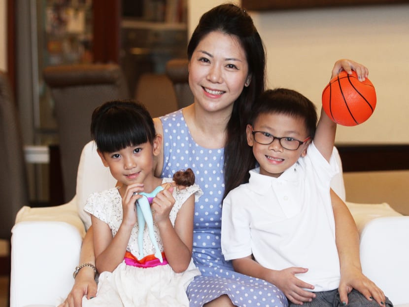 Madam Audrey Lim with her preterm twins Emma and Ethan, who have overcome early battles to grow well, apart from a few 'manageable' issues. Photo: Daryl Kang/TODAY