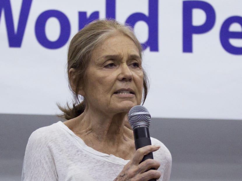 US activist Gloria Steinem, rear center, speaks among the members of the Women Cross DMZ group during a press conference before they leave for Pyongyang, at a hotel in Beijing, China, May 19, 2015. Photo: AP