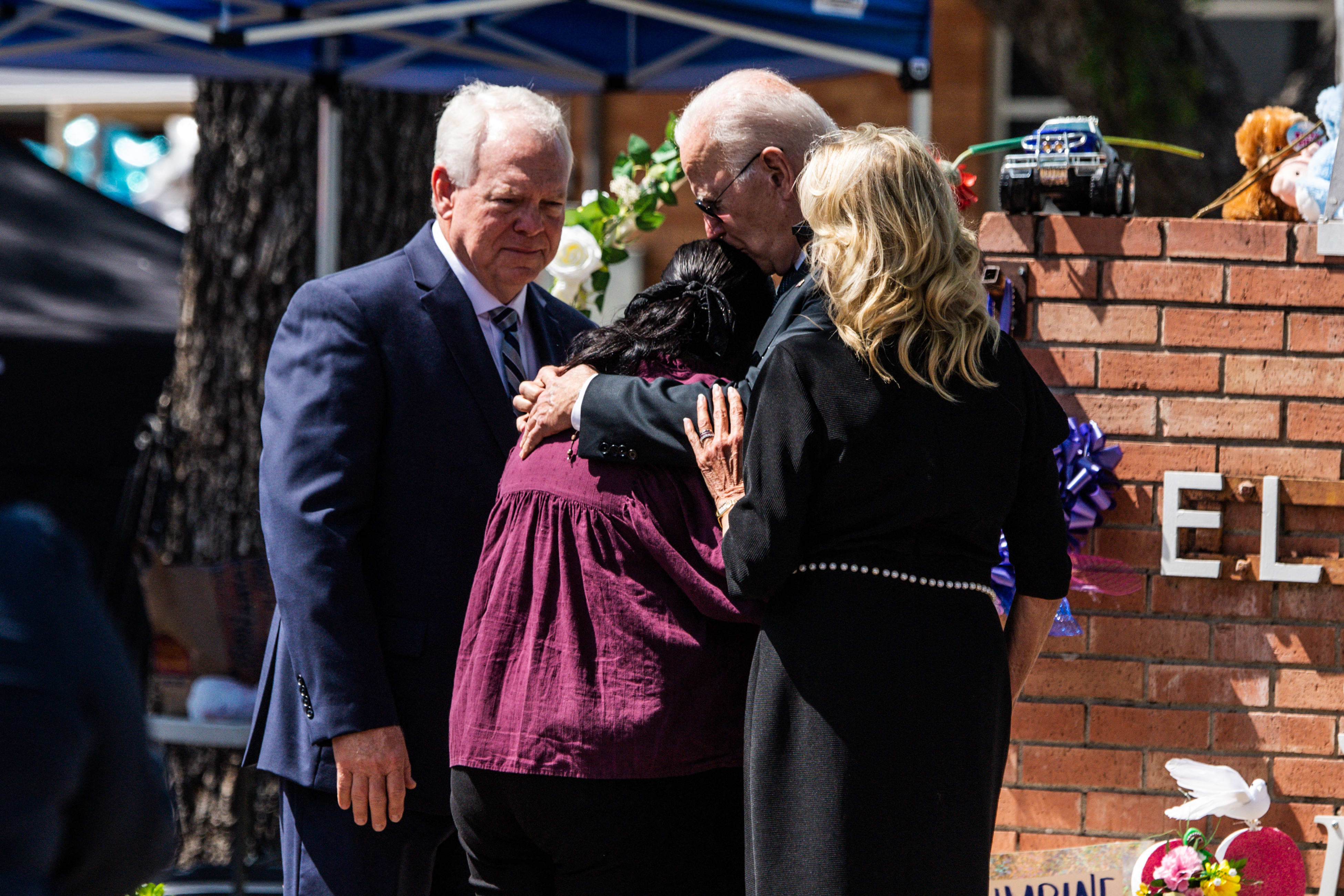 US President Joe Biden embraces Mandy Gutierrez, the principal of Robb Elementary School, as he and First Lady Jill Biden pay their respects in Uvalde, Texas on May 29, 2022,