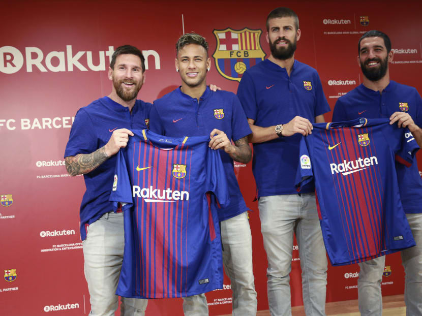 Barcelona's Lionel Messi, Neymar, Gerard Pique, Arda Turan, pose with the club's new jersey during their recent press conference in Tokyo. Photo: AP