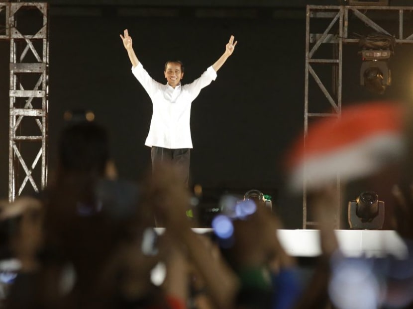 Indonesian President Joko Widodo greets supporters during a celebration after his inauguration as the country's seventh president at the National Monument in Jakarta, Indonesia, Oct 20, 2014. Photo: AP