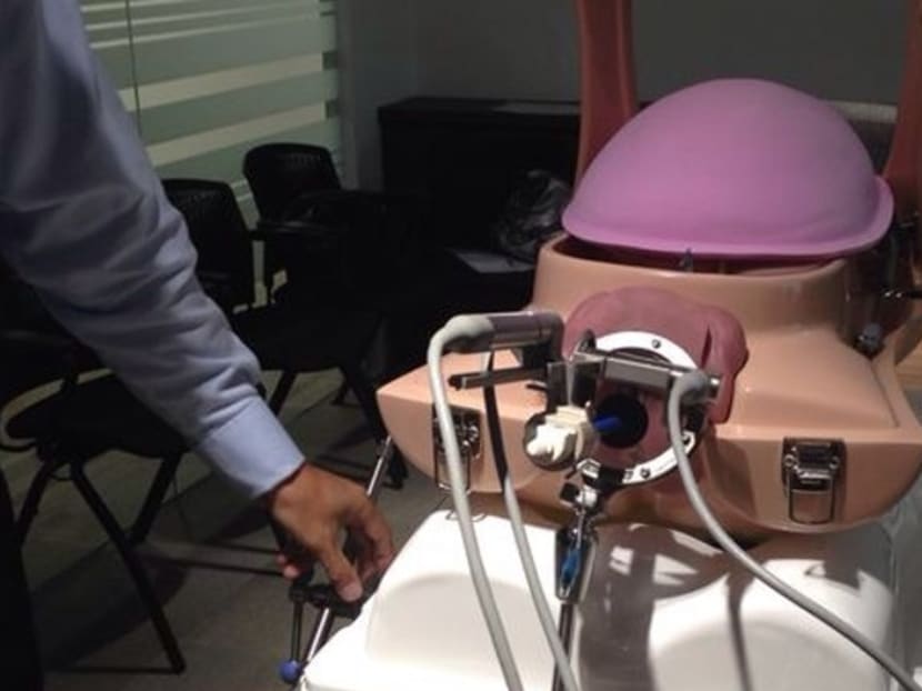 The ViKY Uterus Positioner robot remotely controls the positioning of the uterus during complex gynaecological surgeries. Photo: Channel NewsAsia