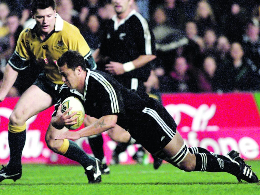 Carlos Spencer (with ball) playing for the New Zealand Maori. The team changed their name to the 
Maori All Blacks two years ago. 
PHOTO: REUTERS