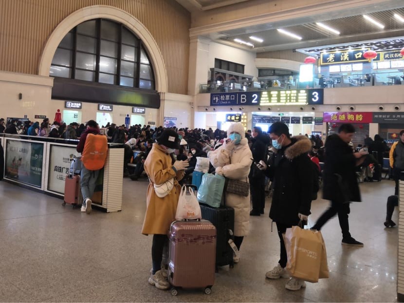Passengers at the Wuhan train station waiting to leave the city on Thursday (Jan 23) morning.
