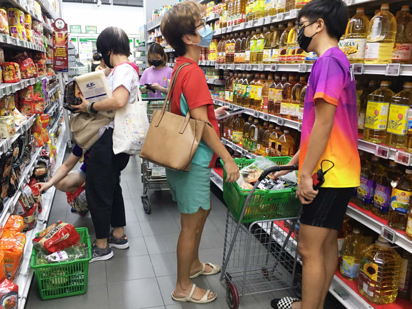 People shopping at NTUC Fairprice at Kampung Admiralty on May 14, 2021. 