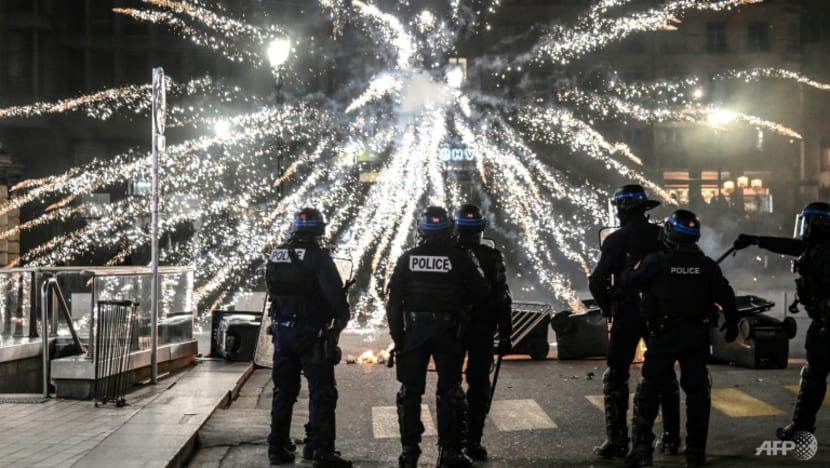 Protests rock France after Macron rams through pension reform