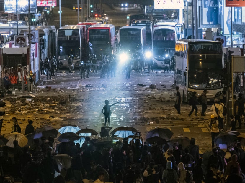 Protesters in Hong Kong face off against riot police during an anti-government demonstration in Mong Kok district on Nov 11, 2019.