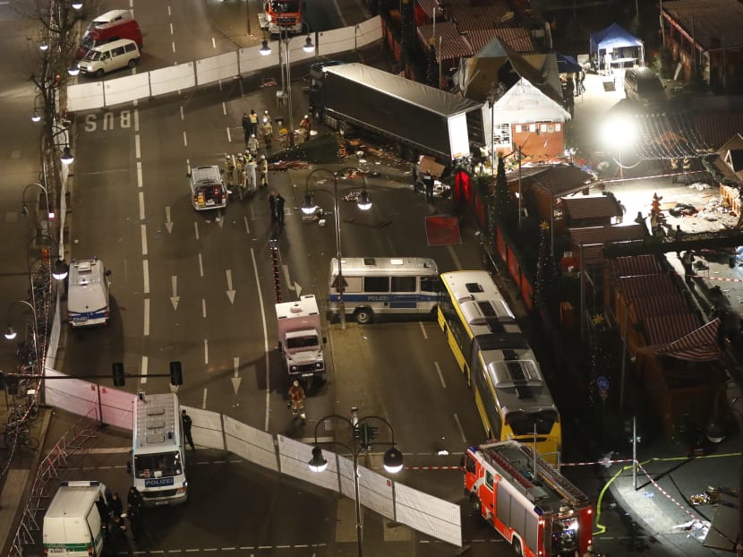 Authorites inspect a truck that had sped into a Christmas market in Berlin, on December 19, 2016, killing at least nine people and injuring dozens more. Photo: AFP